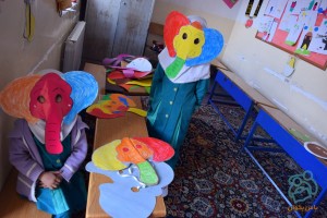 Children making masks for book characters - Read with Me in South Khorasan