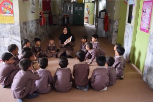 A tutor reads aloud with children - Read with Me in Boshrouyeh - April 2016