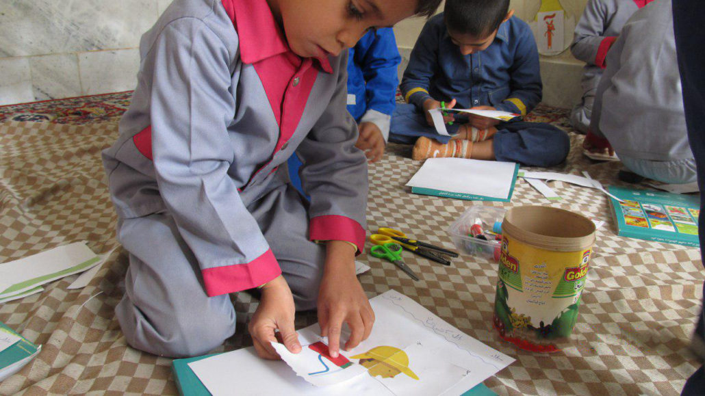 Finding the word "Firefighter" in Dictionary of Picture Riddles and doing the follow-up activities - Read with Me in South Khorasan - January 2017
