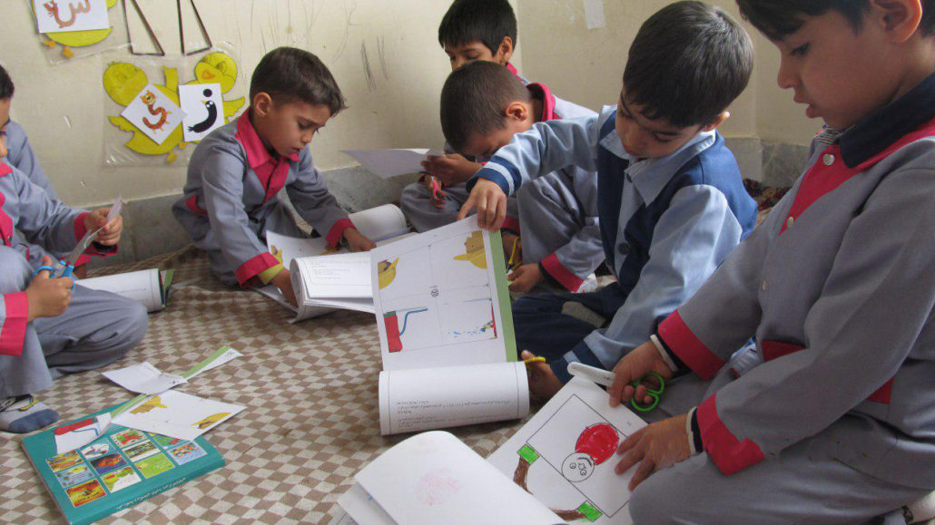 Finding the word "Firefighter" in Dictionary of Picture Riddles and doing the follow-up activities - Read with Me in South Khorasan - January 2017