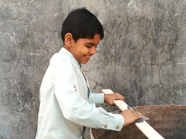 Local children helping in the renovation of salakh library 